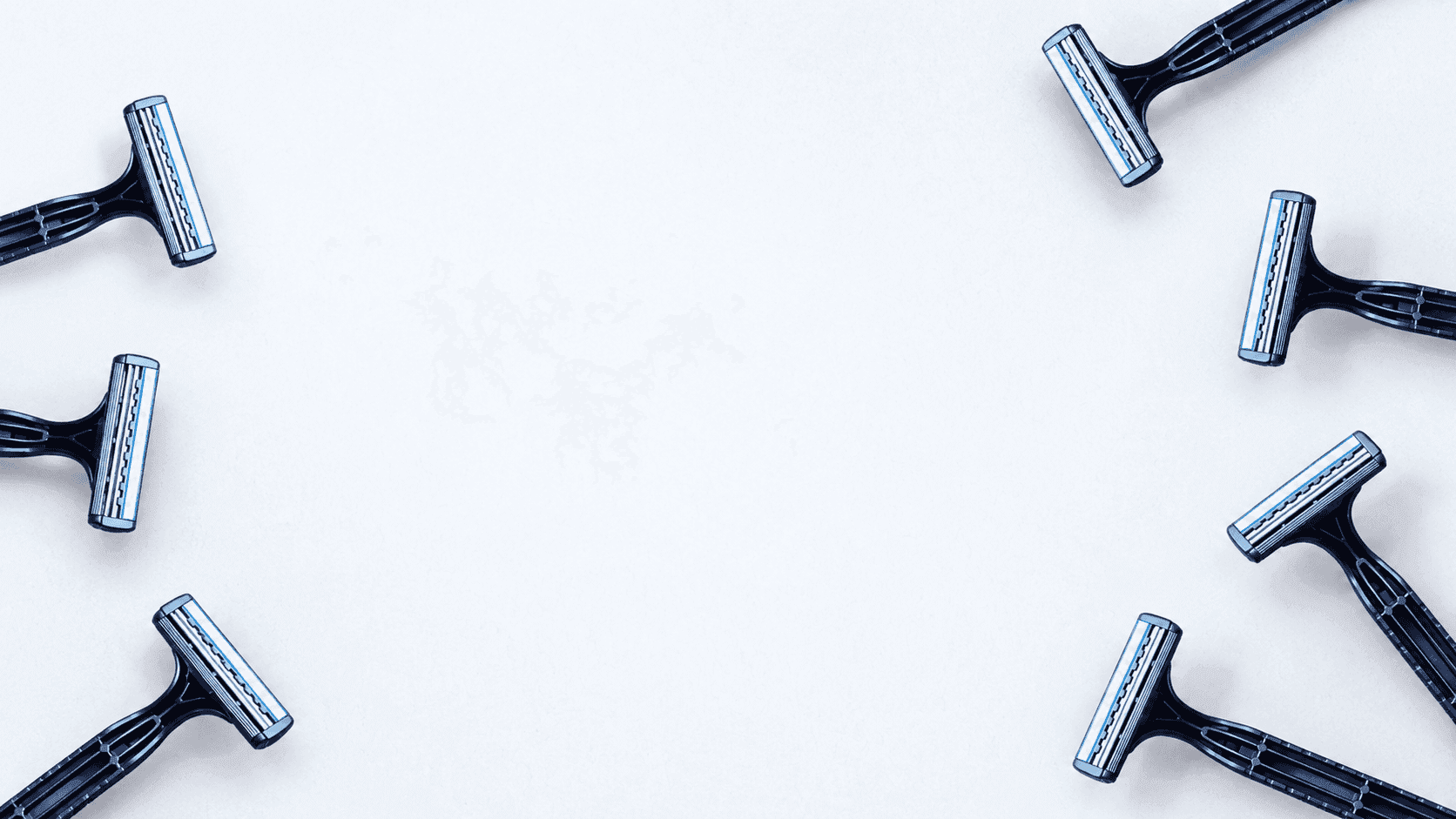 TEZAR razors arranged around a white background